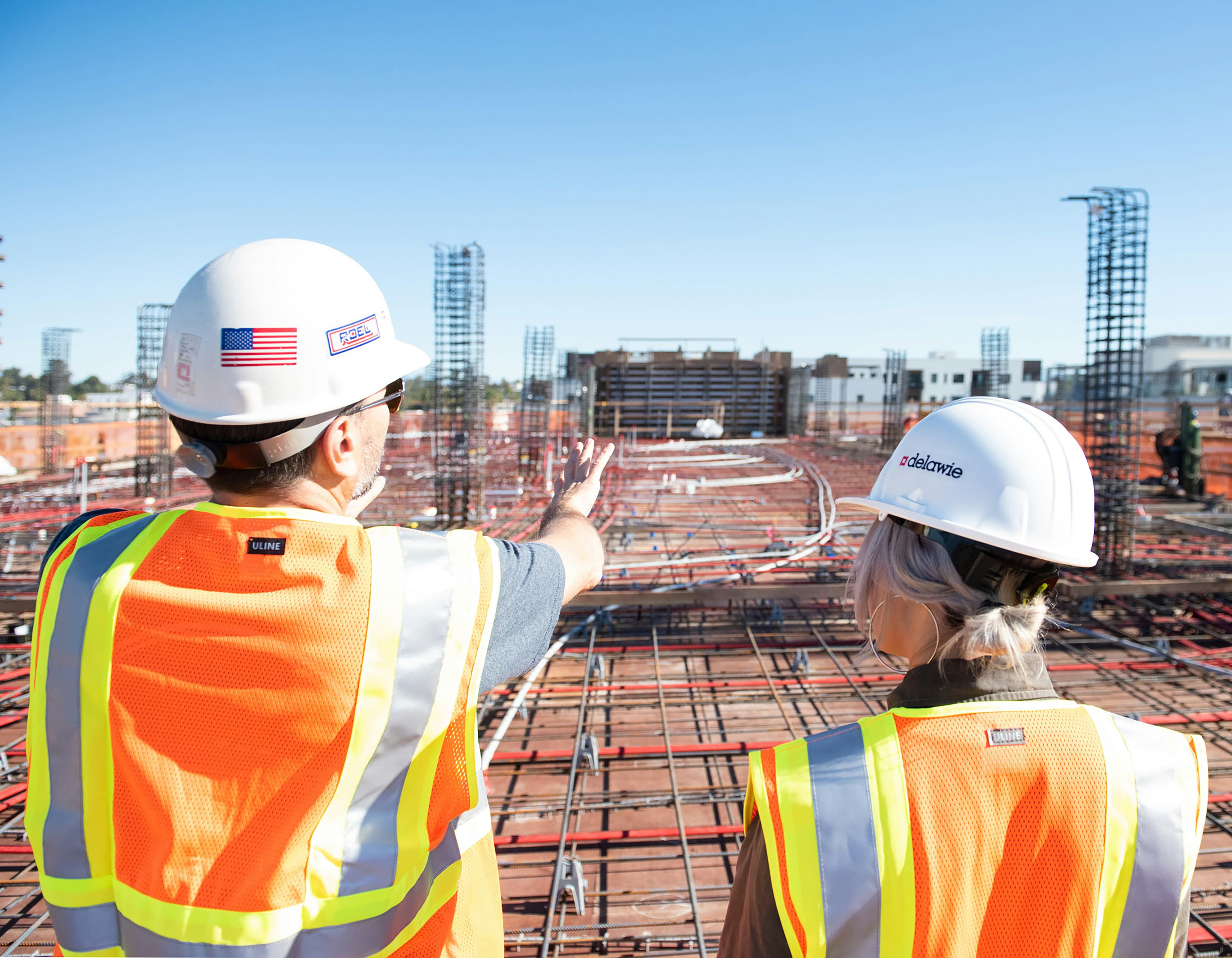 Construction professionals reviewing work on site